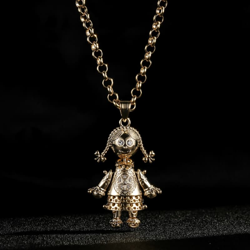 GOLD RAG DOLL PENDANT CLEAR STONES